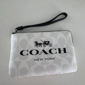 Coach Corner Zip Wristlet In Signature Canvas